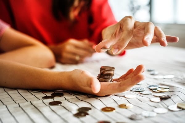 adult counting coins money