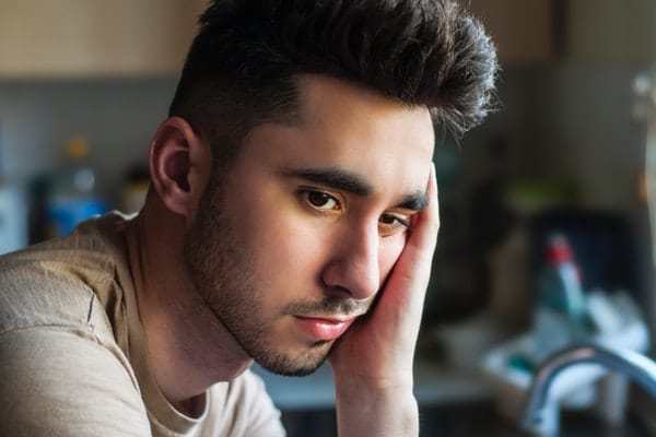young man serious thinking